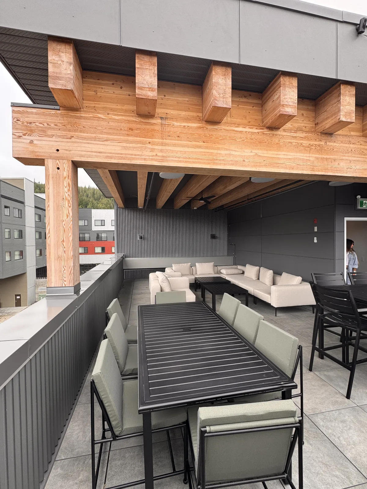 Covered rooftop lounge with RED Mountain views